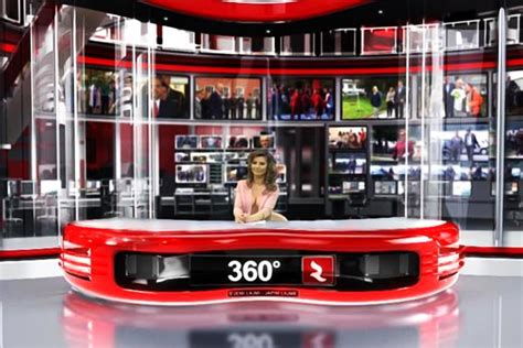 Albanian TV news anchor strips down to boost audience